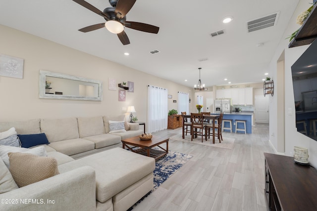 222 River Mist Dr, Saint Augustine, FL 32095 - living room featuring a chandelier, ceiling fan, recessed lighting, and light wood-type flooring