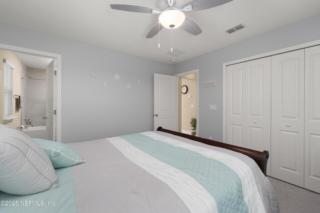 222 River Mist Dr, Saint Augustine, FL 32095 - carpeted bedroom featuring a closet, a ceiling fan, and ensuite bath
