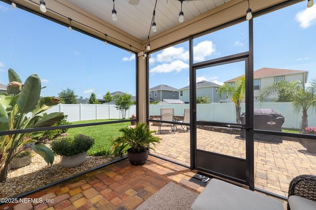 222 River Mist Dr, Saint Augustine, FL 32095 - sunroom / solarium with a ceiling fan and a residential view