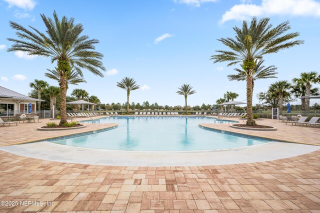 222 River Mist Dr, Saint Augustine, FL 32095 - community pool featuring a patio area