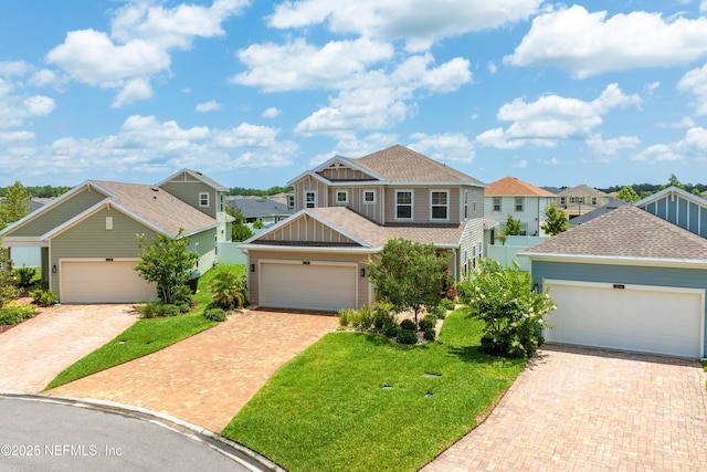 222 River Mist Dr, Saint Augustine, FL 32095 - craftsman-style house featuring board and batten siding, a shingled roof, a front lawn, and a residential view