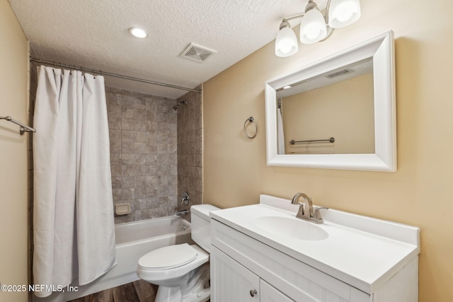 5375 Ortega Farms Blvd Unit 510, Jacksonville, FL 32210 - full bath with a textured ceiling, toilet, vanity, shower / tub combo, and wood finished floors