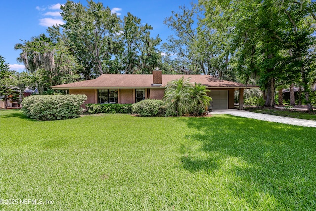 79 Sanchez Dr E, Ponte Vedra Beach, FL 32082 - ranch-style home featuring concrete driveway, an attached garage, a chimney, a front lawn, and brick siding