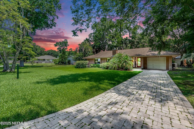 79 Sanchez Dr E, Ponte Vedra Beach, FL 32082 - ranch-style home with a garage, decorative driveway, and a lawn
