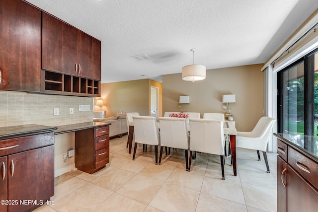 79 Sanchez Dr E, Ponte Vedra Beach, FL 32082 - kitchen featuring backsplash, a textured ceiling, pendant lighting, open shelves, and light tile patterned flooring