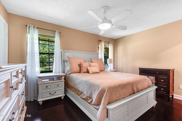 79 Sanchez Dr E, Ponte Vedra Beach, FL 32082 - bedroom with a textured ceiling, dark wood finished floors, baseboards, and a ceiling fan