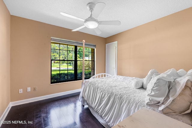79 Sanchez Dr E, Ponte Vedra Beach, FL 32082 - bedroom with dark wood-style floors, baseboards, ceiling fan, and a textured ceiling