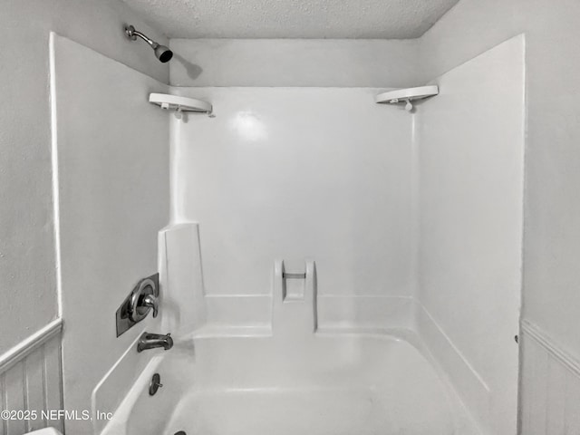 102 Courageous Ct N Unit 102, Jacksonville, FL 32233 - full bathroom featuring a textured ceiling and bathtub / shower combination