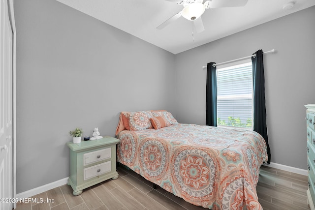 202 Purus Way, Jacksonville, FL 32259 - bedroom featuring baseboards, wood tiled floors, and a ceiling fan