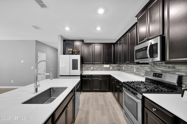 202 Purus Way, Jacksonville, FL 32259 - kitchen with stainless steel appliances, a sink, tasteful backsplash, light countertops, and recessed lighting