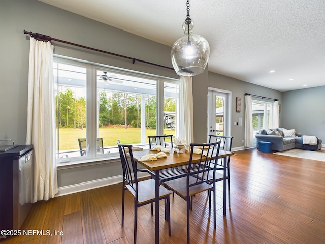 75610 Edwards Rd, Yulee, FL 32097 - dining space featuring dark wood-style flooring, plenty of natural light, baseboards, recessed lighting, and a textured ceiling