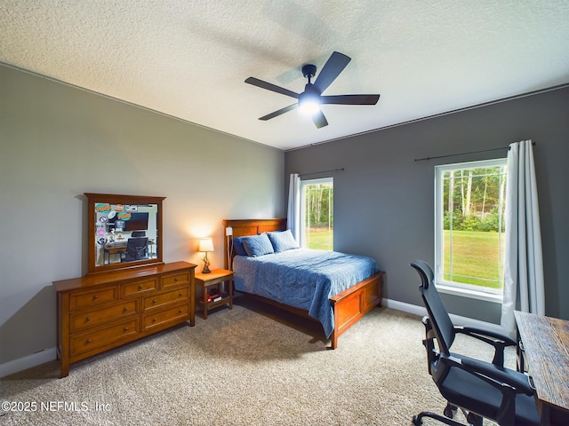 75610 Edwards Rd, Yulee, FL 32097 - bedroom with light colored carpet, a textured ceiling, baseboards, and ceiling fan