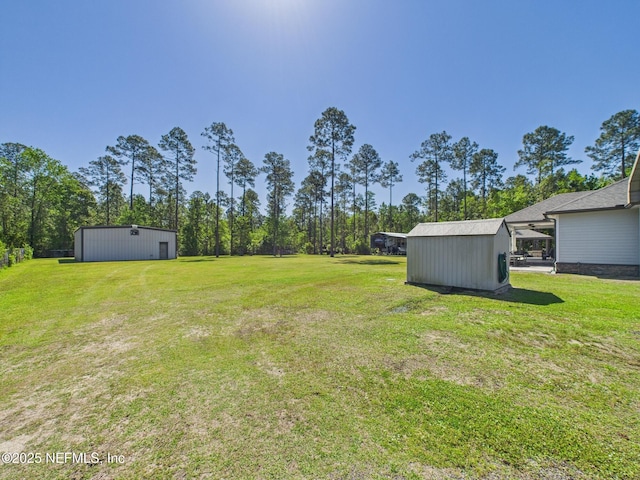 75610 Edwards Rd, Yulee, FL 32097 - view of green lawn featuring an outbuilding and a pole building
