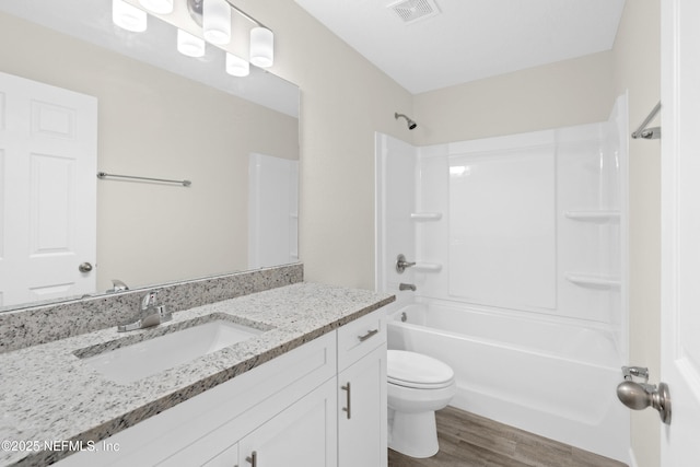 8204 Dandy Ave, Jacksonville, FL 32211 - bathroom featuring toilet, wood finished floors, bathing tub / shower combination, and vanity