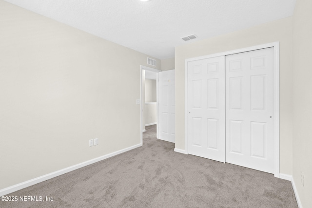 8204 Dandy Ave, Jacksonville, FL 32211 - unfurnished bedroom featuring carpet, baseboards, and a closet