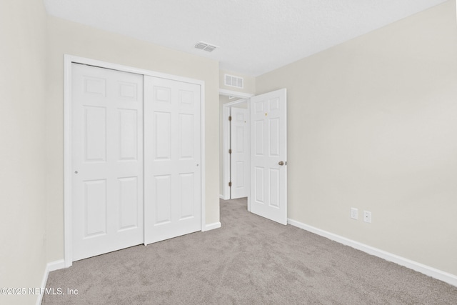 8204 Dandy Ave, Jacksonville, FL 32211 - unfurnished bedroom featuring carpet, a closet, and baseboards