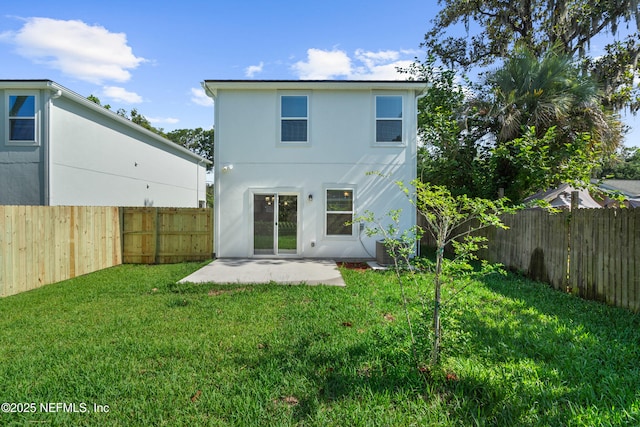 8204 Dandy Ave, Jacksonville, FL 32211 - back of house with a patio and stucco siding
