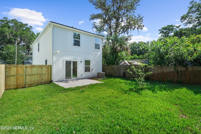8204 Dandy Ave, Jacksonville, FL 32211 - back of house with stucco siding, a patio, and central air condition unit