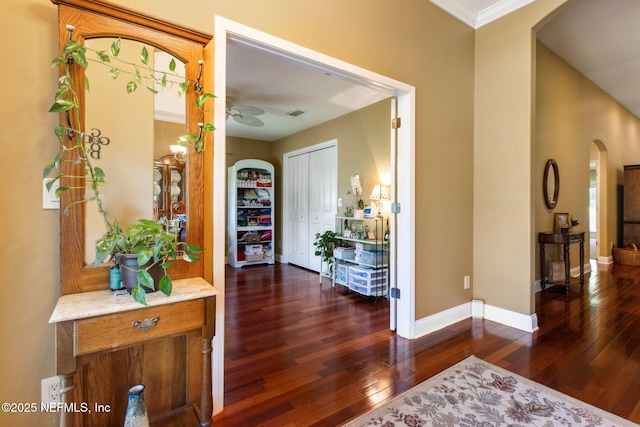 166 Mount Royal Ave, Crescent City, FL 32112 - hall with arched walkways, hardwood / wood-style floors, baseboards, and ornamental molding