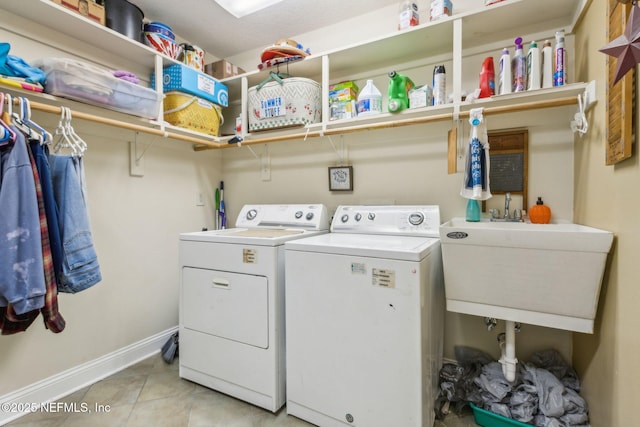 166 Mount Royal Ave, Crescent City, FL 32112 - washroom featuring washer and clothes dryer, baseboards, and light tile patterned flooring
