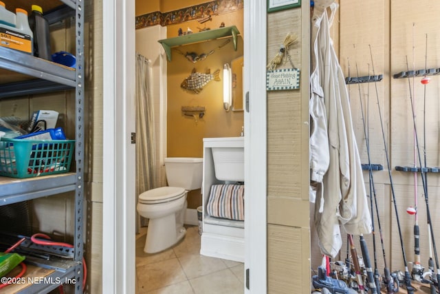 166 Mount Royal Ave, Crescent City, FL 32112 - bathroom with tile patterned floors, toilet, and baseboards