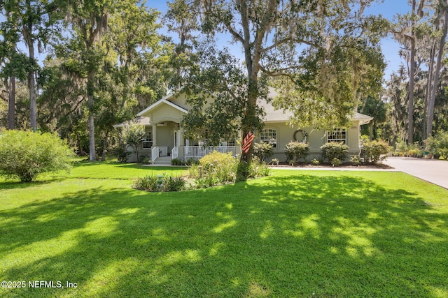 166 Mount Royal Ave, Crescent City, FL 32112 - view of property hidden behind natural elements featuring a front lawn and a porch