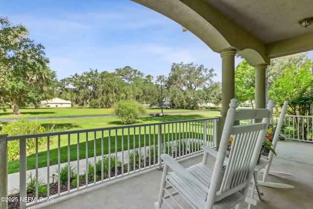 166 Mount Royal Ave, Crescent City, FL 32112 - porch featuring a lawn and view of wooded area