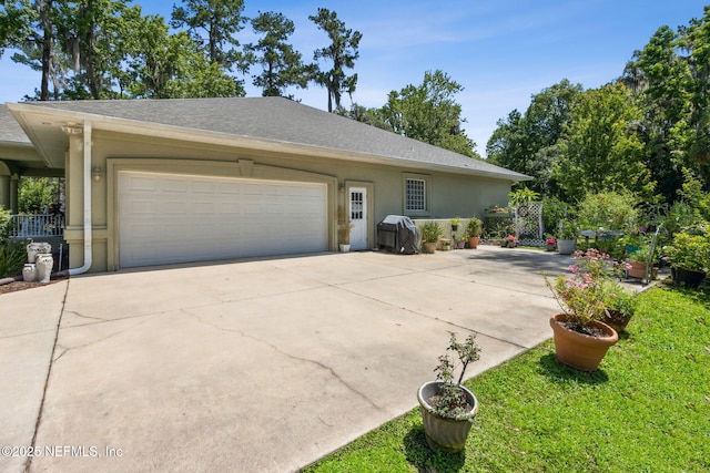 166 Mount Royal Ave, Crescent City, FL 32112 - view of front of property with an attached garage, stucco siding, driveway, roof with shingles, and a front lawn
