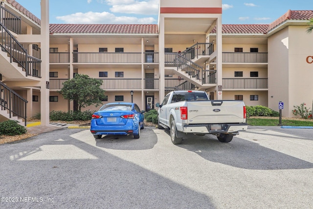 4250 A1A S Unit C15, Saint Augustine, FL 32080 - view of apartment building / complex with uncovered parking and stairs