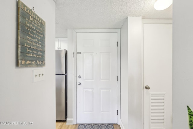 4250 A1A S Unit C15, Saint Augustine, FL 32080 - hall with a textured ceiling and light wood-type flooring