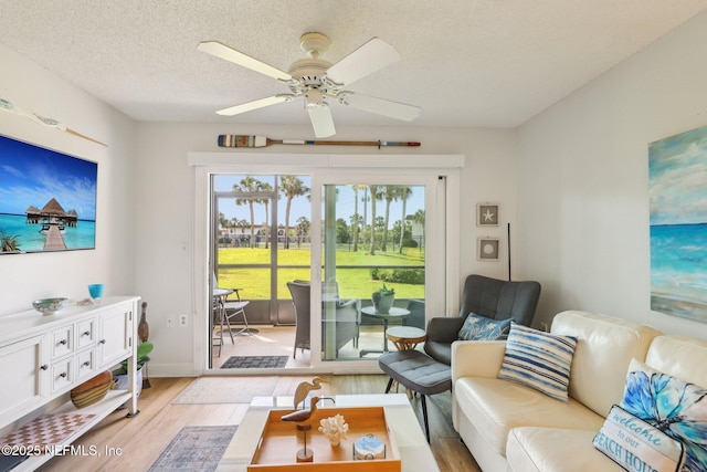 4250 A1A S Unit C15, Saint Augustine, FL 32080 - living room with light wood-style flooring, a ceiling fan, and a textured ceiling