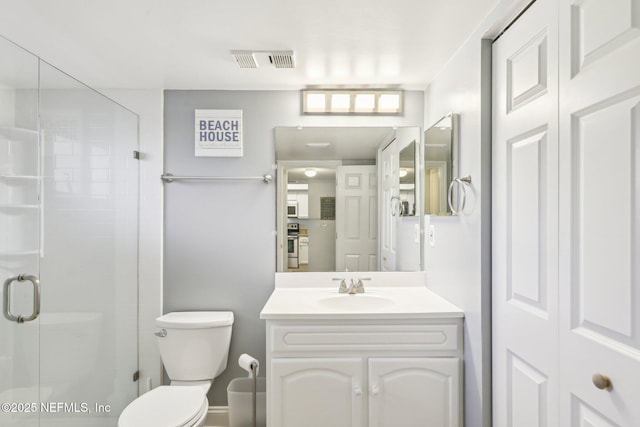 4250 A1A S Unit C15, Saint Augustine, FL 32080 - bathroom with vanity, a stall shower, and toilet
