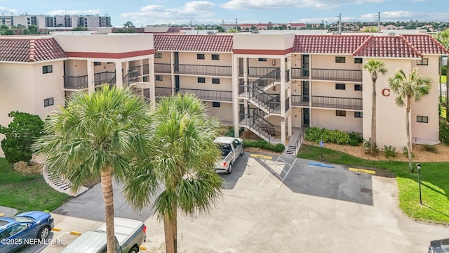 4250 A1A S Unit C15, Saint Augustine, FL 32080 - view of property with uncovered parking and stairway