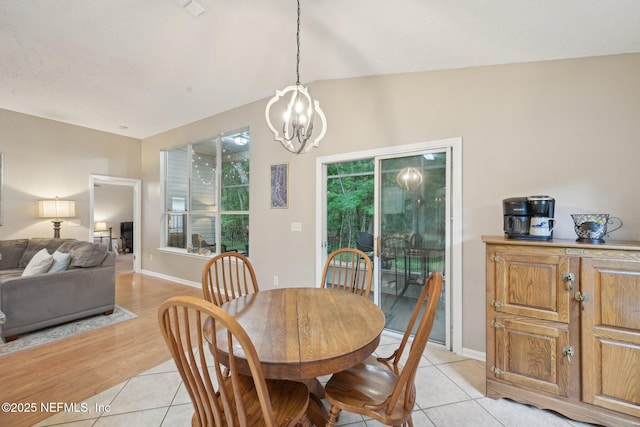 1494 Cedar Grove Ter, Fleming Island, FL 32003 - dining area featuring a chandelier, light tile patterned floors, and baseboards