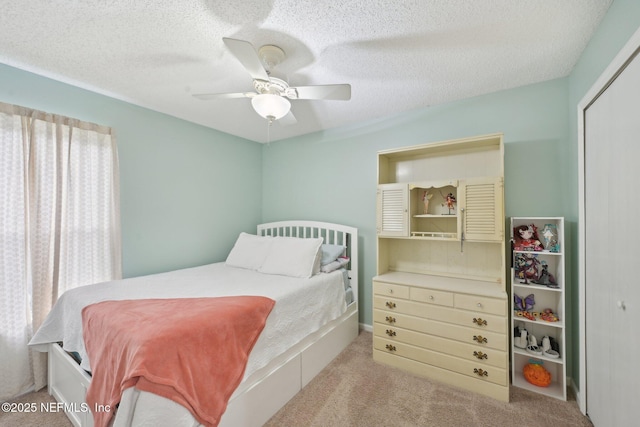 1494 Cedar Grove Ter, Fleming Island, FL 32003 - carpeted bedroom featuring a closet, ceiling fan, and a textured ceiling