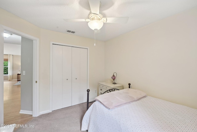 1494 Cedar Grove Ter, Fleming Island, FL 32003 - bedroom featuring a closet, ceiling fan, baseboards, and light carpet