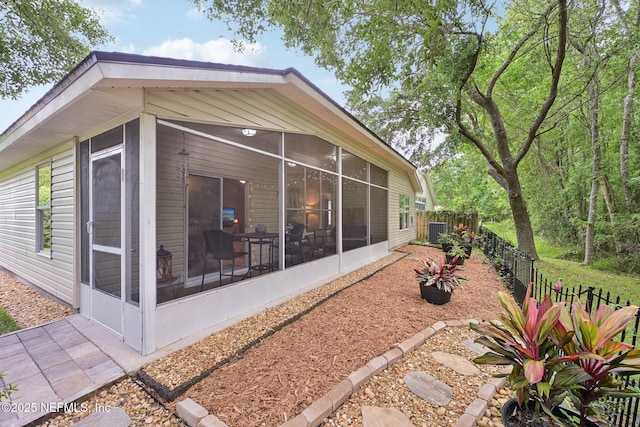 1494 Cedar Grove Ter, Fleming Island, FL 32003 - rear view of house featuring a sunroom and cooling unit
