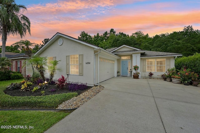1494 Cedar Grove Ter, Fleming Island, FL 32003 - single story home featuring concrete driveway, a garage, and stucco siding