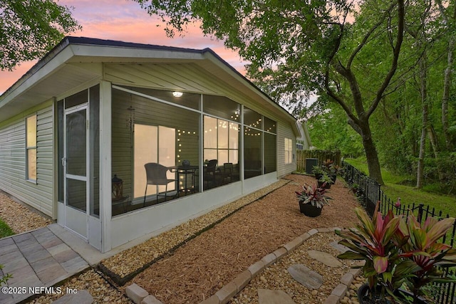 1494 Cedar Grove Ter, Fleming Island, FL 32003 - rear view of house featuring a sunroom
