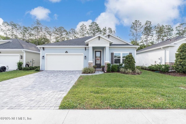 710 Stillwater Blvd, Saint Johns, FL 32259 - view of front facade featuring an attached garage, decorative driveway, and a front lawn