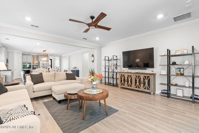 710 Stillwater Blvd, Saint Johns, FL 32259 - living room with ceiling fan, recessed lighting, crown molding, light wood-type flooring, and baseboards
