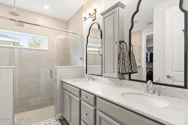 710 Stillwater Blvd, Saint Johns, FL 32259 - bathroom featuring a stall shower, double vanity, and a walk in closet