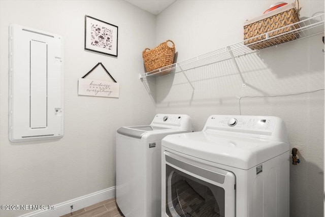 710 Stillwater Blvd, Saint Johns, FL 32259 - washroom featuring separate washer and dryer, baseboards, and light wood-style floors