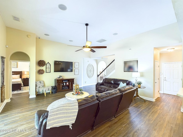 85667 Berryessa Way, Fernandina Beach, FL 32034 - living area with arched walkways, wood finished floors, ceiling fan, stairway, and baseboards