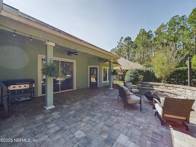 85667 Berryessa Way, Fernandina Beach, FL 32034 - view of patio featuring a ceiling fan, an outdoor fire pit, and grilling area