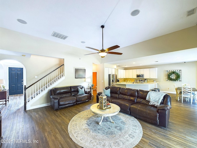 85667 Berryessa Way, Fernandina Beach, FL 32034 - living area with stairway, wood finished floors, arched walkways, and ceiling fan
