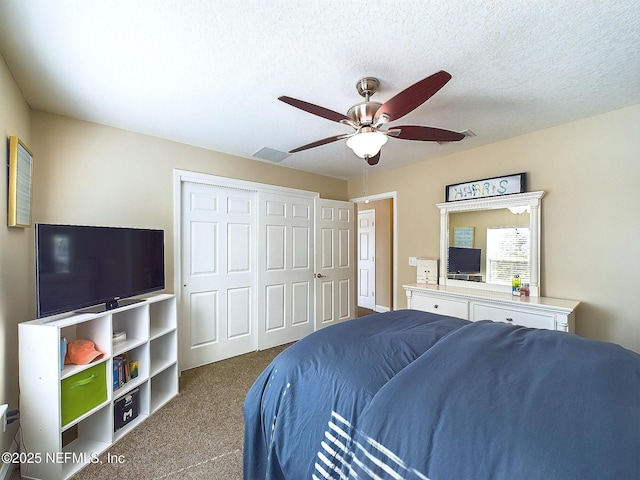 85667 Berryessa Way, Fernandina Beach, FL 32034 - carpeted bedroom featuring a closet, ceiling fan, and a textured ceiling