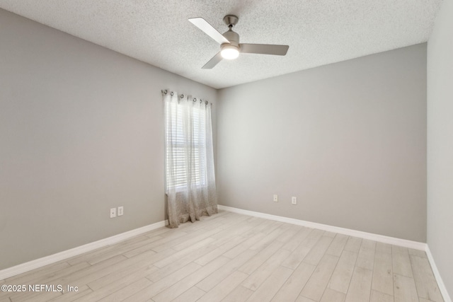 1254 Palisades Dr, Jacksonville, FL 32221 - unfurnished room with ceiling fan, light wood-style floors, baseboards, and a textured ceiling