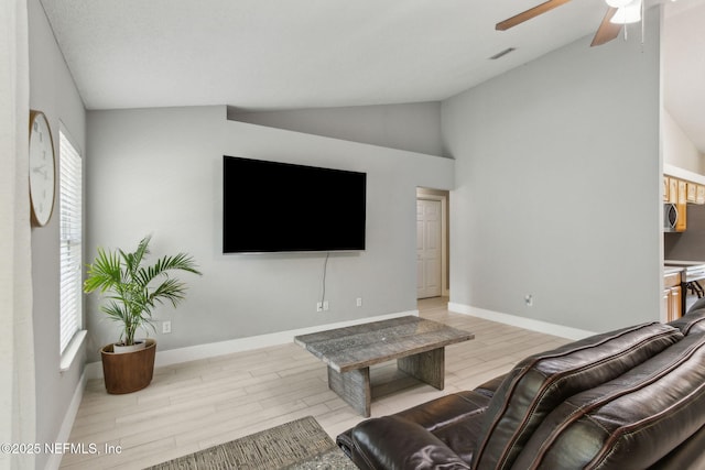 1254 Palisades Dr, Jacksonville, FL 32221 - living area featuring lofted ceiling, light wood-style flooring, a ceiling fan, and baseboards