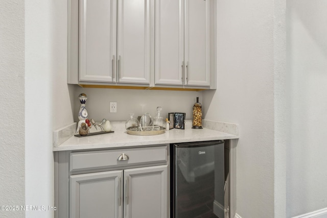 244 Caribbean Pl, Saint Johns, FL 32259 - indoor dry bar with freestanding refrigerator